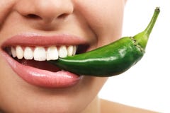 Woman eating green vegetable raw pepper Stock Image Woman eating green vegetable raw pepper Stock Image