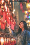 Woman enjoyed looking at red lamps and wishes in Chinese temple royalty free stock photos Woman enjoyed looking at red lamps and wishes in Chinese temple royalty free stock photos