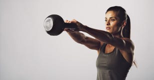 Woman exercise with kettle bell - Crossfit workout royalty free stock photography Woman exercise with kettle bell - Crossfit workout royalty free stock photography