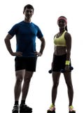 Woman exercising fitness workout with man coach posing Royalty Free Stock Photo Woman exercising fitness workout with man coach posing Royalty Free Stock Photo
