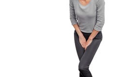 Woman experiences pain in perineum. Hands pressed to vagina, lower abdomen. Urinary incontinence. Gynecological problems. Woman`s