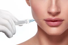 Woman face and hand in glove with syringe making injection Royalty Free Stock Photography Woman face and hand in glove with syringe making injection Royalty Free Stock Photography
