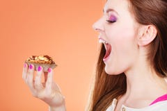 Woman face profile holds cake in hand stock photos Woman face profile holds cake in hand stock photos