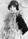 Woman in a feather boa and hat stock photos Woman in a feather boa and hat stock photos