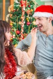 Woman Feeding a Man With Sweet Cookies or Cake from a Plate royalty free stock photos Woman Feeding a Man With Sweet Cookies or Cake from a Plate royalty free stock photos