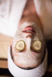 Woman is getting facial clay mask at spa stock photography Woman is getting facial clay mask at spa stock photography