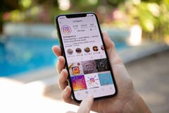 Woman Hand Holding IPhone X With Social Networking Service Instagram Stock Images Woman Hand Holding IPhone X With Social Networking Service Instagram Stock Images