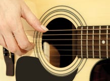 Woman Hand On An Acoustic Guitar Stock Image