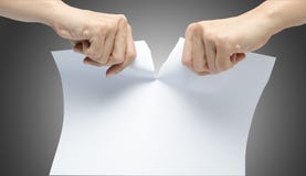 Woman Hand Ripping White Paper On Gray Background Stock Photos