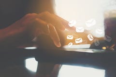 Woman hand using smartphone to send and recieve email for business on nature bokeh background. royalty free stock photography Woman hand using smartphone to send and recieve email for business on nature bokeh background. royalty free stock photography