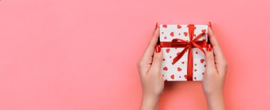 Woman Hands Give Valentine Or Other Holiday Handmade Present In Paper With Red Ribbon. Present Box, Red Heart Decoration Of Gift Stock Photography