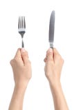 Woman hands holding a fork and a knife Stock Photography Woman hands holding a fork and a knife Stock Photography