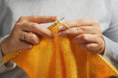 Woman hands with knitting needles and wool yarn. Needlework concept stock photography Woman hands with knitting needles and wool yarn. Needlework concept stock photography