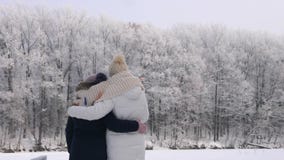 Woman with her daughter looking at the frost trees stock video footage Woman with her daughter looking at the frost trees stock video footage