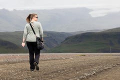 Woman hiker walking in mountain landscape stock photography Woman hiker walking in mountain landscape stock photography