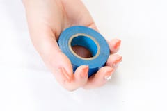 Woman holding blue electrical isolation tape in hand royalty free stock image Woman holding blue electrical isolation tape in hand royalty free stock image