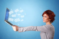 Woman holding laptop with online symbols stock image Woman holding laptop with online symbols stock image