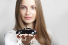 Woman Holding Little Car Royalty Free Stock Image