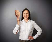 Woman holding mad mask royalty free stock photo Woman holding mad mask royalty free stock photo