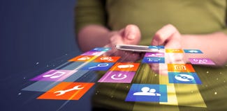 Woman holding smart phone with colorful application icons stock photography Woman holding smart phone with colorful application icons stock photography