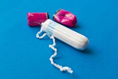 Woman hygiene protection. Cotton tampons on blue stock photos Woman hygiene protection. Cotton tampons on blue stock photos