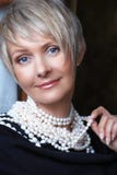 Woman In Pearls In Her 40s Royalty Free Stock Photography Woman In Pearls In Her 40s Royalty Free Stock Photography