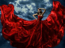 Woman In Red Evening Dress, Waving Gown With Flying Long Fabric Stock Photos Woman In Red Evening Dress, Waving Gown With Flying Long Fabric Stock Photos