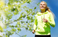 Woman jogging outdoors stock image Woman jogging outdoors stock image