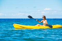Woman Kayaking in the Ocean on Vacation royalty free stock photography Woman Kayaking in the Ocean on Vacation royalty free stock photography