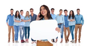 Woman leader holding speech bubble while speaking on the phone stock photos Woman leader holding speech bubble while speaking on the phone stock photos