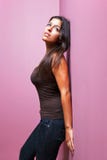 Woman leaning against a wall stock photos Woman leaning against a wall stock photos