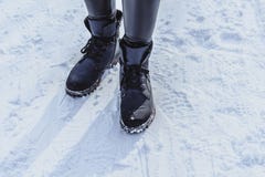 Woman legs in boots on the snow royalty free stock photo Woman legs in boots on the snow royalty free stock photo