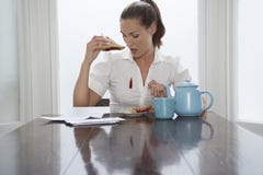 Woman Looking At Stain On Shirt royalty free stock images Woman Looking At Stain On Shirt royalty free stock images
