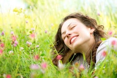 Woman lying in Meadow of Flowers