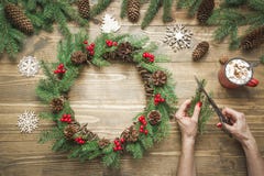 Woman making Christmas wreath using fresh natural materials. Workshop. Xmas. Workshop. royalty free stock image Woman making Christmas wreath using fresh natural materials. Workshop. Xmas. Workshop. royalty free stock image