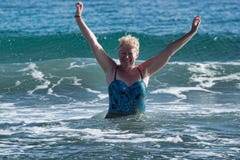 A woman of mature age in a swimsuit stock image A woman of mature age in a swimsuit stock image