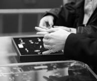 Woman measuring rings in shop royalty free stock photo Woman measuring rings in shop royalty free stock photo