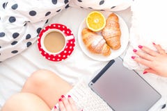 Woman On Bed With Tablet, Breakfast And Coffee, Relaxing On A Sunday Morning Stock Photos Woman On Bed With Tablet, Breakfast And Coffee, Relaxing On A Sunday Morning Stock Photos