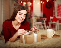 Woman open box with gift on background of Christmas decorations Stock Images Woman open box with gift on background of Christmas decorations Stock Images