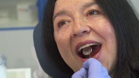 Woman opens her mouth for dental check up stock video Woman opens her mouth for dental check up stock video