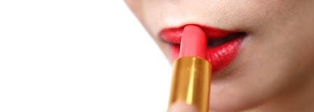 Woman painting a red lipstick, closeup, isolated, abstract, texture, on the white background royalty free stock images Woman painting a red lipstick, closeup, isolated, abstract, texture, on the white background royalty free stock images
