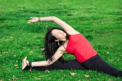 Woman Performs Side Bend In Park Stock Images Woman Performs Side Bend In Park Stock Images