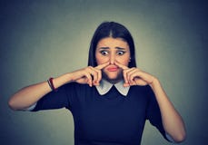 Woman pinches nose looks with disgust something stinks bad smell royalty free stock photos Woman pinches nose looks with disgust something stinks bad smell royalty free stock photos