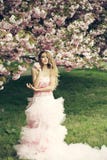 Woman in pink dress near bloom Stock Images Woman in pink dress near bloom Stock Images