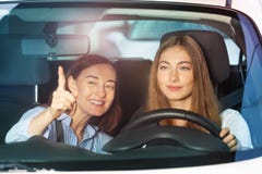 Woman pointing finger on something sitting in car royalty free stock photo Woman pointing finger on something sitting in car royalty free stock photo
