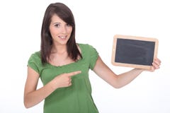 Woman pointing a slate stock image Woman pointing a slate stock image