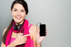 Woman pointing to her smart mobile phone royalty free stock image Woman pointing to her smart mobile phone royalty free stock image