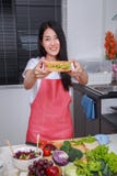 Woman preparing a sandwich in kitchen room royalty free stock images Woman preparing a sandwich in kitchen room royalty free stock images