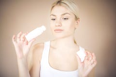 Woman putting concealer on cheek. stock image Woman putting concealer on cheek. stock image