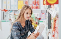 Woman reading food labels